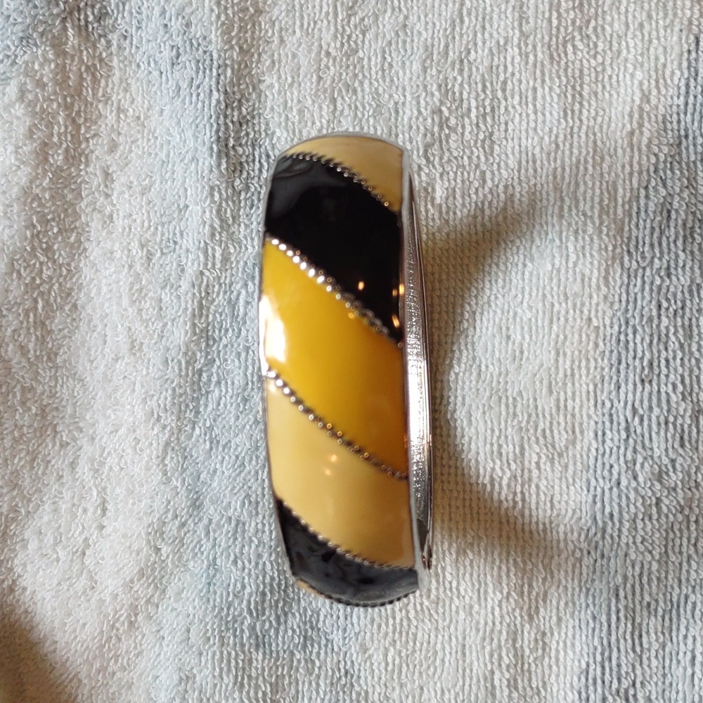 Cuff bracelet, yellow, silver, and black, like new.